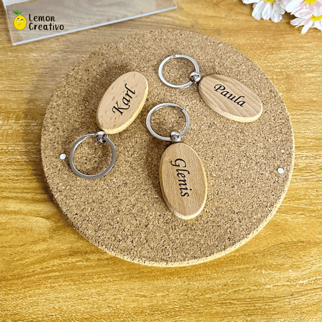 Oval wooden keychain laser-engraved with a company logo