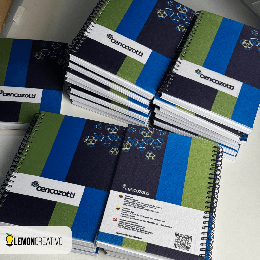 A5 hardcover spiral notebook printed in full color with a company logo