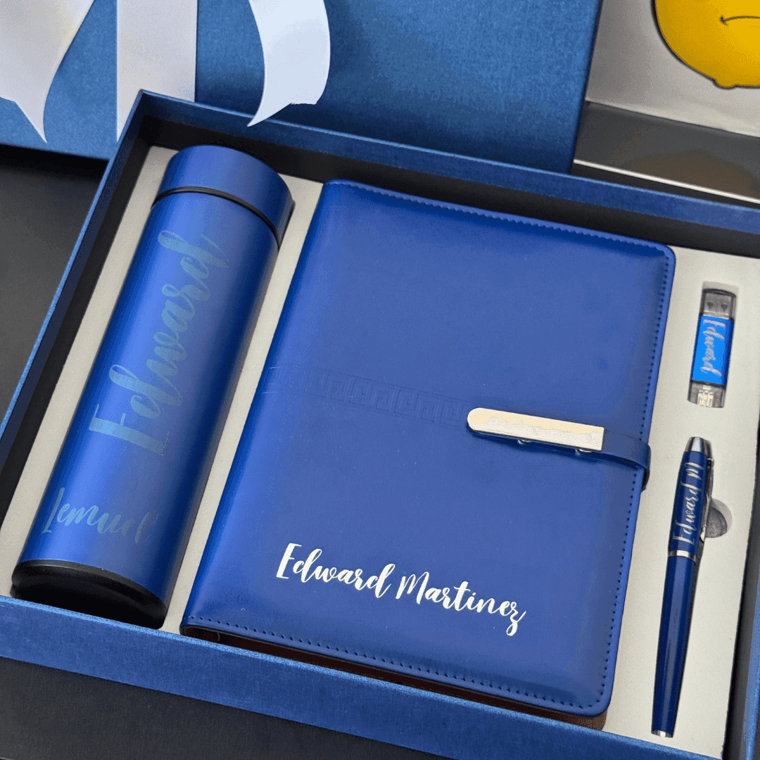 4-piece corporate gift box with planner, pen, USB drive, and bottle